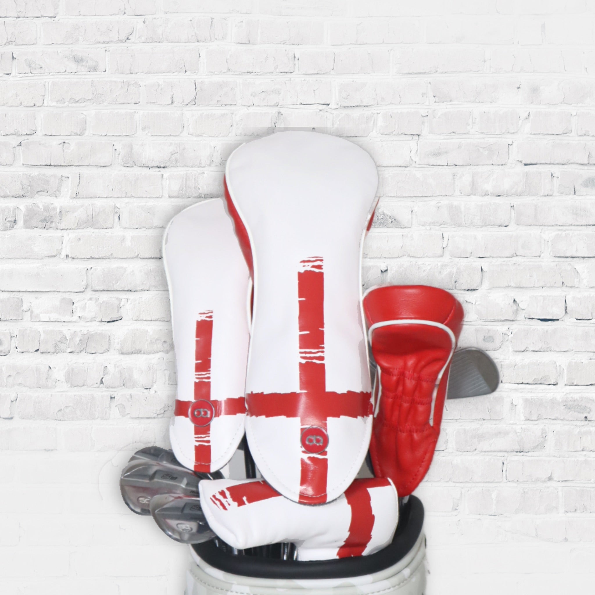 England red and white leather golf club headcovers. St. Georges cross design by Dave Alexander