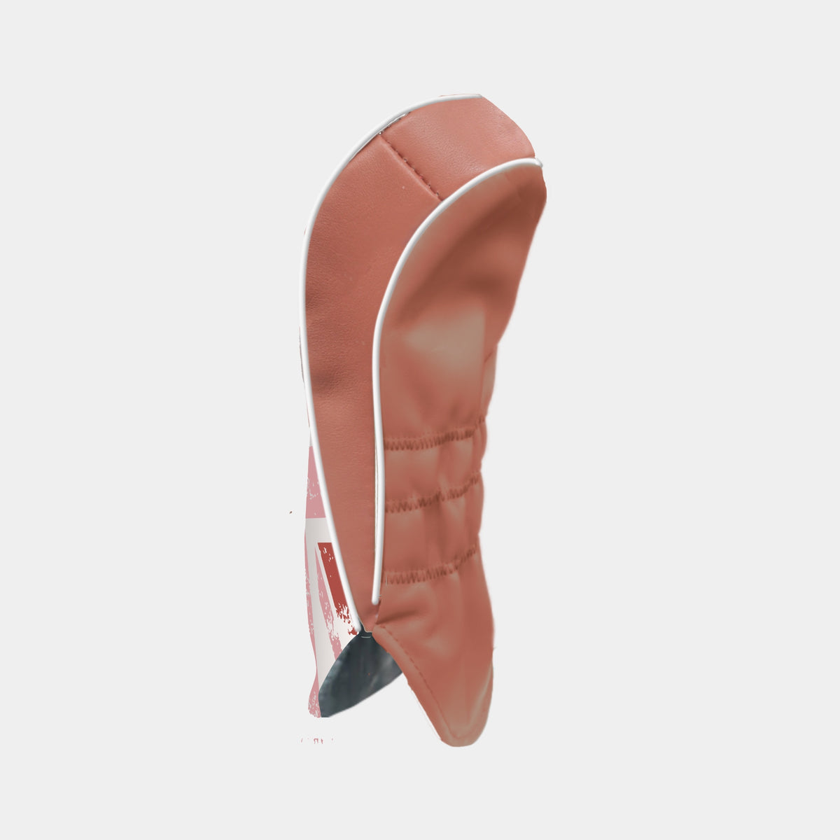 The reverse of a leather terracotta golf club headcover with white piping and shown on a plain light gray background.