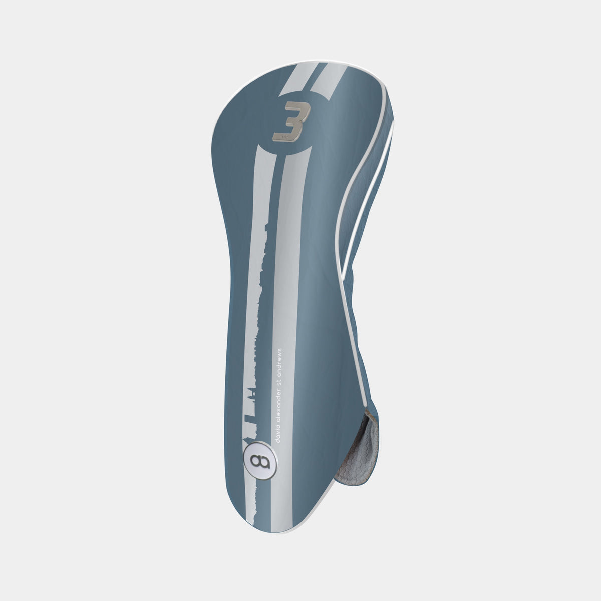 A Madeira blue and white golf club headcover with a vertical St. Andrews cityscape stripe design and a chrome number 3 on the upper portion shown on a light gray background.