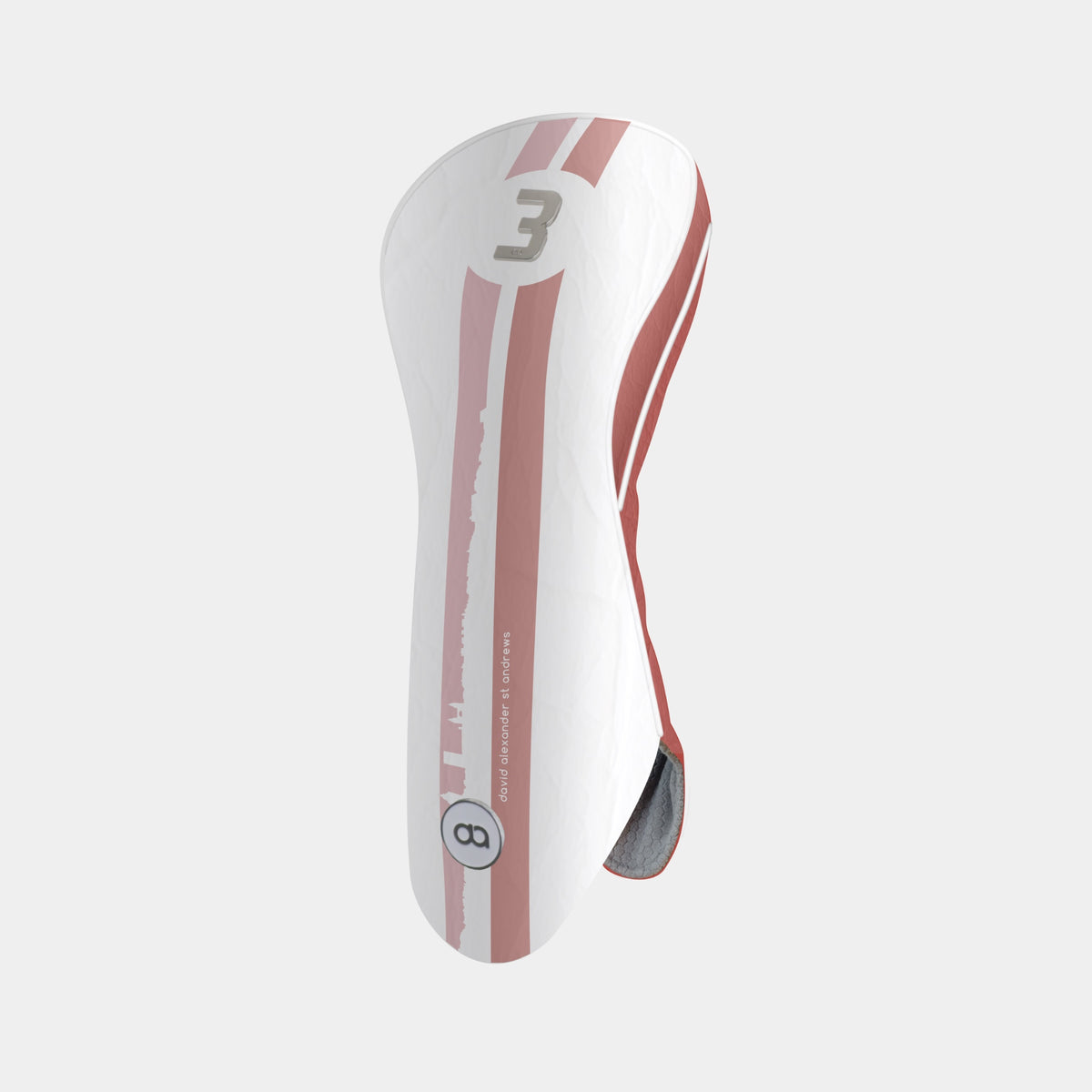 A white and terracotta golf club headcover with a vertical St. Andrews cityscape stripe design and a chrome number 3 on the upper portion shown on a light gray background.