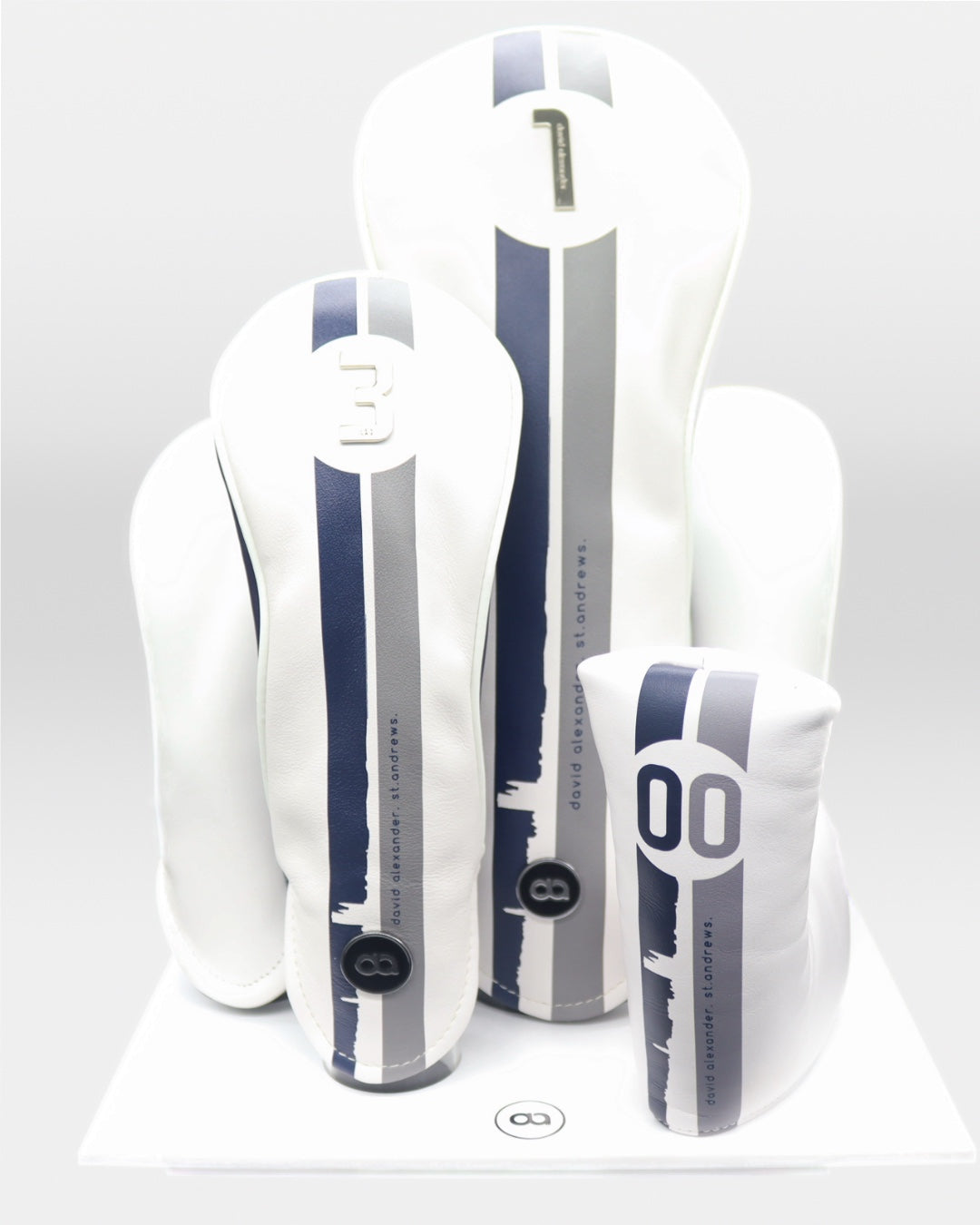 Set of white and navy blue leather david alexander-designed headcovers