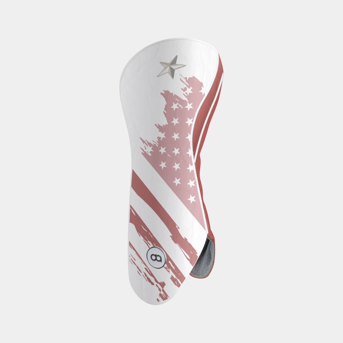 A golf club headcover featuring a distressed American flag design with pink and terracotta stripes and stars on a white background, shown against a light gray studio backdrop.