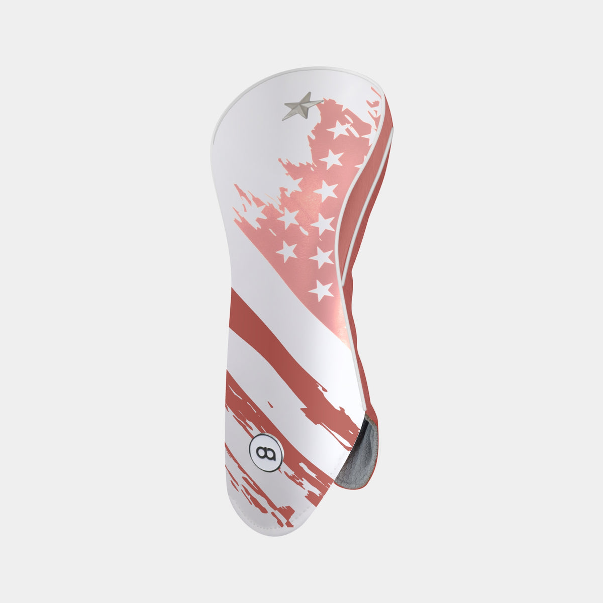 A golf club headcover featuring a distressed American flag design with pink and terracotta stripes and stars on a white background, shown against a light gray studio backdrop.