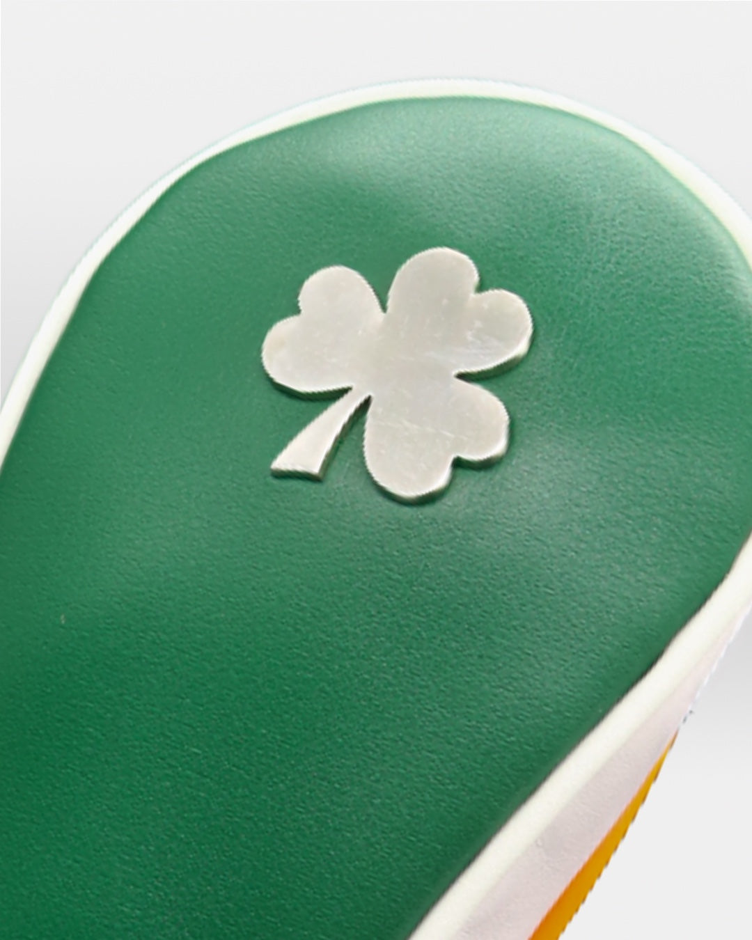 Green chrome shamrock on a green, white and orange ireland leather fairway headcover