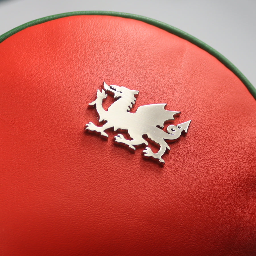 Close up of chrome Welsh dragon on re leather driver head-cover by David Alexander.