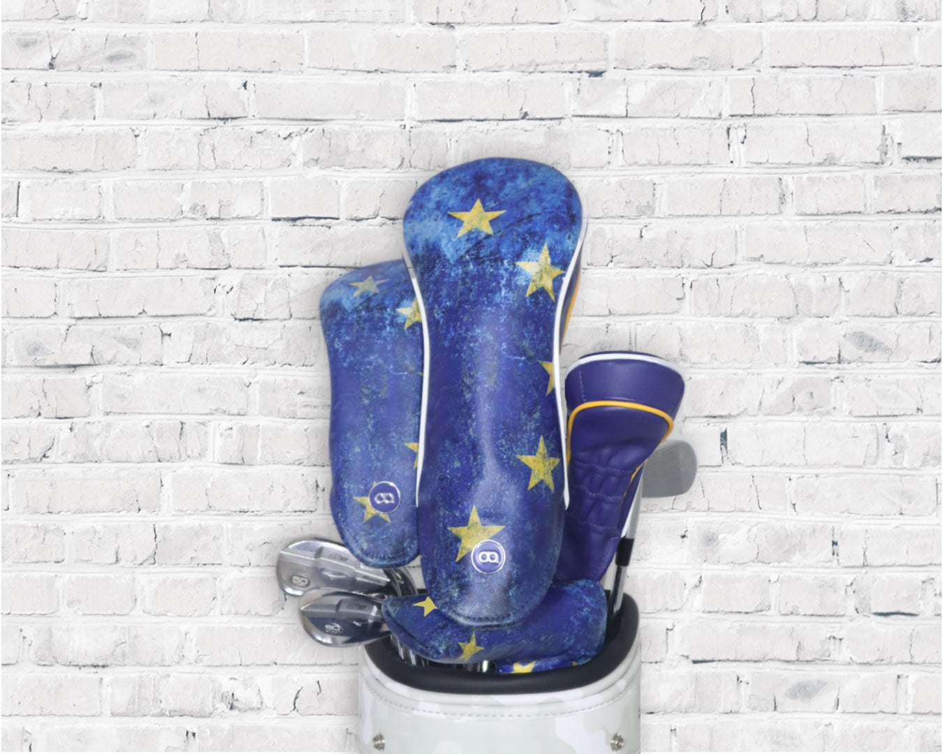 A set of blue and yellow Europe leather headcovers by David Alexander.