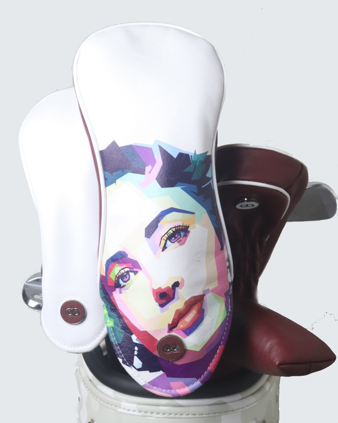 Set of women's white and burgundy leather headcover by David Alexander. 
