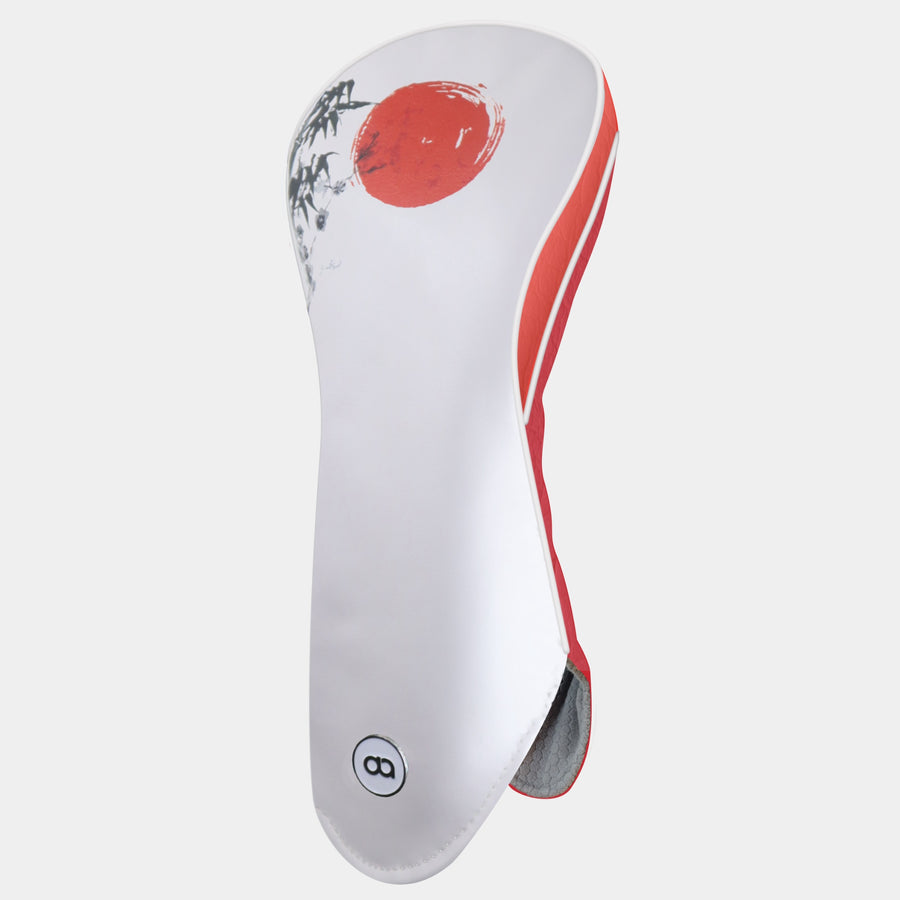 A white and red leather golf club headcover with a red circular sun graphic and tree branch illustration shown on a light gray background.