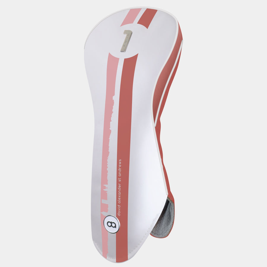 St. Andrews edition white and terracotta leather golf club headcover with a bold pink and terracotta racing stripe design, featuring a metal club identifier.