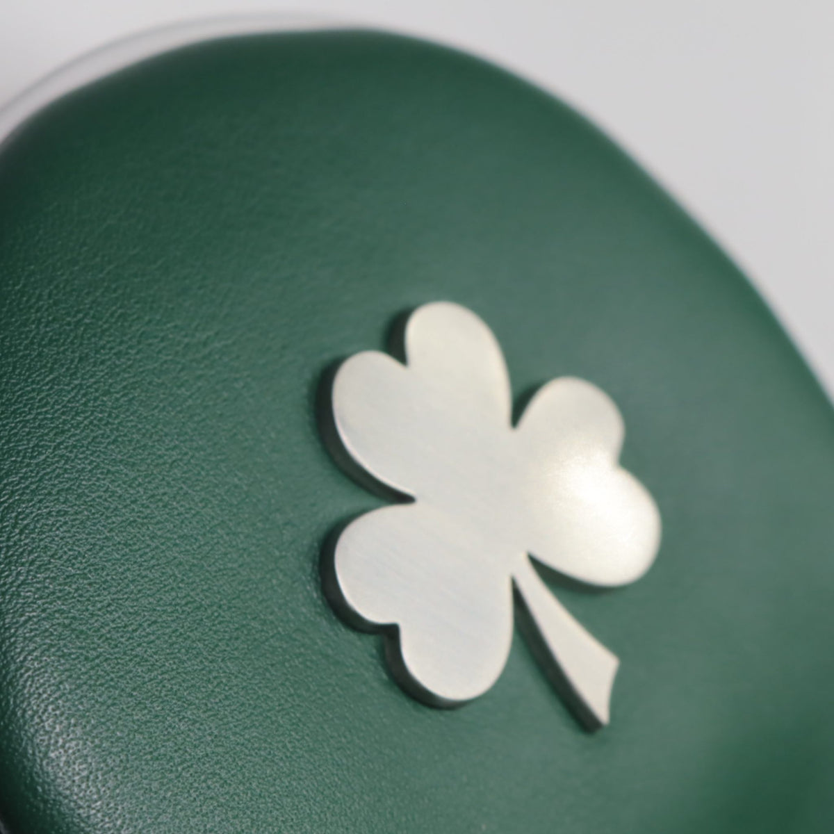 Green chrome shamrock on a green, white and orange ireland leather fairway headcover